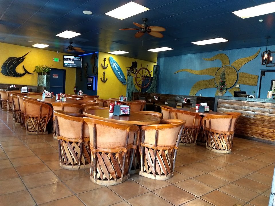 Seafood dishes on a casual restaurant table.