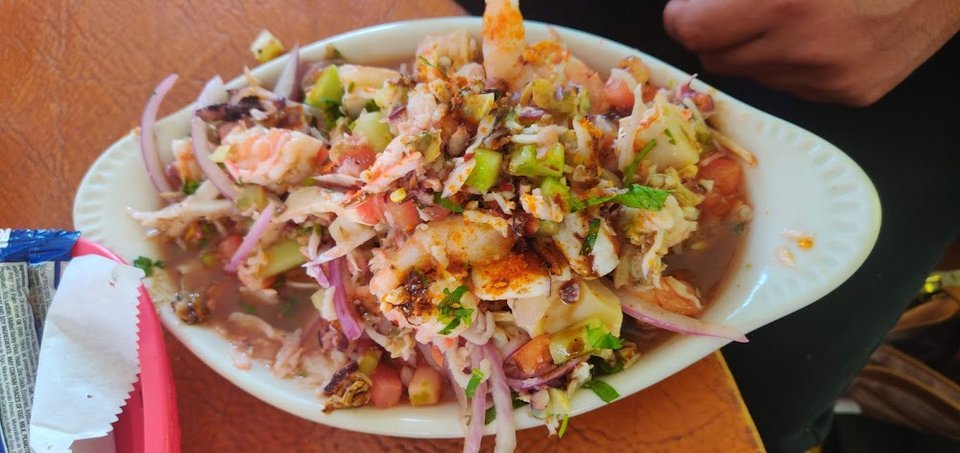Menu page featuring shrimp and fish dishes.
