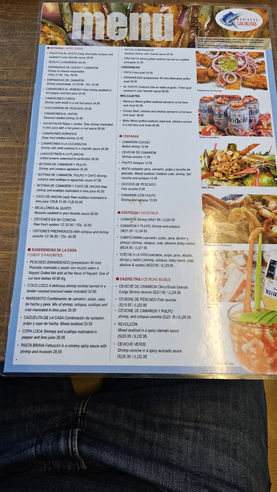 Printed seafood menu with tacos and appetizers.